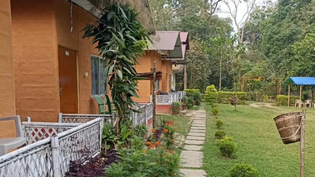 Tiger Camp Kaziranga cottages and landscaped garden surrounded by greenery